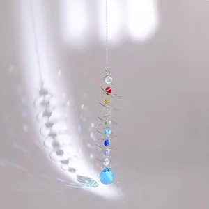 Rainbow crystal suncatcher with spiral metal tail and blue prism ball pendant