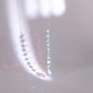 Silver spiral suncatcher with blue beads and a faceted crystal ball prism hanging