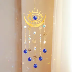 Large crescent moon and evil eye crystal suncatcher with blue droplets and sun charms