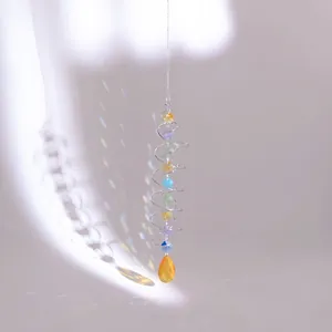 Detail of crystal suncatcher showing colorful faceted beads and a teardrop pendant