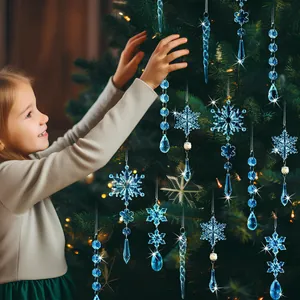 Blue acrylic snowflake and icicle Christmas tree ornaments set on a cozy holiday tree