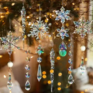 Iridescent acrylic snowflake and icicle ornaments hanging on a Christmas tree with bokeh light