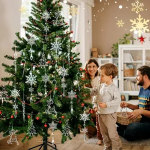 Detailed view of clear acrylic snowflake and icicle ornaments hanging on a Christmas tree