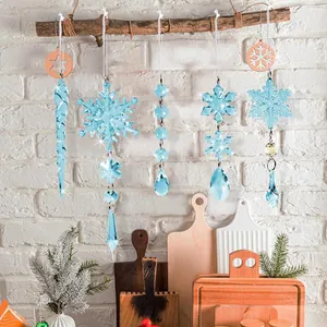Detail of light blue crystal acrylic snowflake and icicle ornaments on wood branches