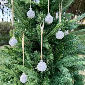 6-piece silver Christmas ball ornaments with crystal rhinestones on a green festive tree