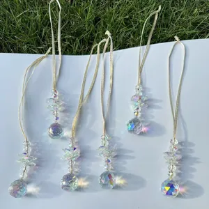 Detail of 6-piece crystal suncatcher set showing faceted prisms and rainbow light refraction