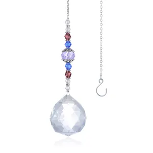Macro shot of 40mm crystal ball suncatcher with colorful beads and metal chain