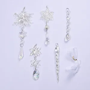 Iridescent acrylic snowflake and icicle Christmas tree ornaments set with white ribbon