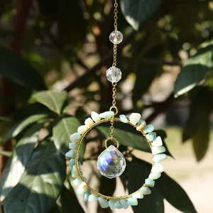 Handmade gold suncatcher with natural light blue crystals and multi-faceted glass ball