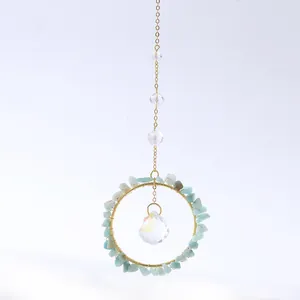 Handmade gold suncatcher with natural light green crystal stones and faceted crystal ball