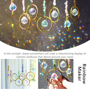 Rainbow suncatchers with crystal prisms and natural stones reflecting light on wall