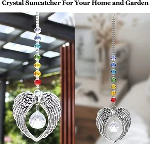 Macro detail of angel wing suncatcher with colorful beads and crystal prism ball