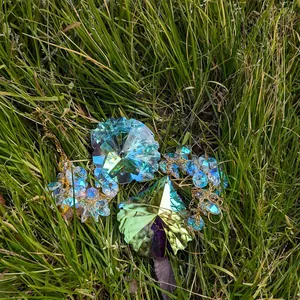 Detailed macro view of rainbow prism suncatchers with AB coating on green grass