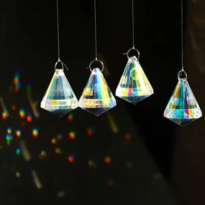 Detailed macro view of four diamond-cut iridescent crystal prisms with rainbow light effects