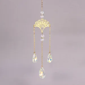 Detail of golden ginkgo leaf suncatcher with faceted crystal droplets and fine chain