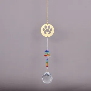 Macro detail of suncatcher featuring gold cat paw charm and rainbow crystal beads