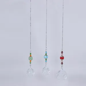 Detail of three crystal suncatchers with colorful beads and faceted glass prism balls