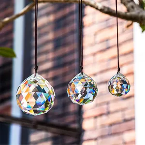 Set of 3 faceted crystal suncatcher prism balls in varying sizes with hanging cords
