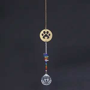 Detail of golden pet paw suncatcher with heart cut-out and colorful crystal prism beads