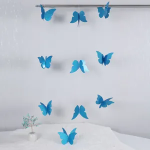 Detalle de mariposa 3D azul de doble capa con purpurina para decoración de fiestas