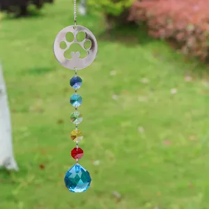 Detail of crystal suncatcher with hollow cat paw charm and colorful octagon beads