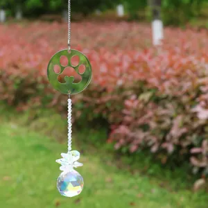 Close-up of crystal suncatcher with a heart-shaped pet paw print metal charm and crystal ball