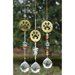 Three gold paw print suncatchers with rainbow crystal beads and faceted glass balls