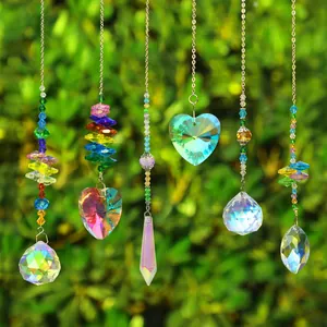 Detailed view of six crystal suncatchers with rainbow prisms hanging in a garden