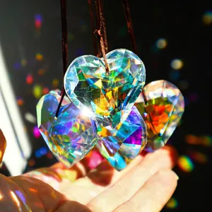 Two 45mm heart crystal suncatchers with AB coating producing rainbow light reflections