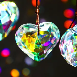 Macro view of multifaceted heart-shaped crystal prism with vibrant rainbow light refraction