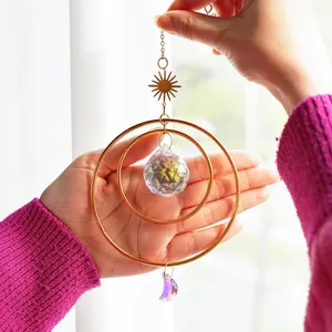 Double-ring suncatcher with faceted crystal ball, sun and moon charms for home decor