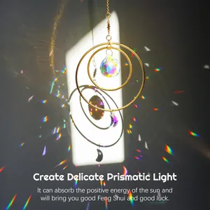 Close-up of golden suncatcher rings with crystal ball casting rainbow prism light effects
