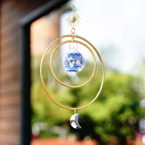 Golden sun and moon suncatcher with crystal ball and purple crescent for window decor