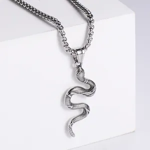 Polished silver snake pendant necklace in stainless steel with detailed scale texture