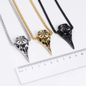 Vintage raven skull pendant in steel, gold, and black with Norse Viking runes