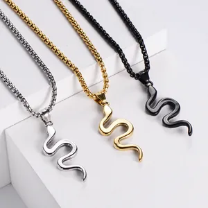 Snake pendant necklaces in silver, gold and black stainless steel on white stands