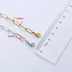 Detailed view of gold and silver paperclip chains with 12mm length and 4mm width measurement