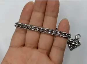 Detailed view of silver stainless steel Cuban link chain necklace with lobster clasp