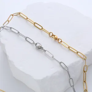 Flat oval link necklace in gold and silver steel with lobster clasp on stone