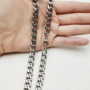 Close-up of thick silver stainless steel curb chain with a secure lobster clasp