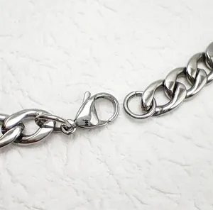 Polished stainless steel Cuban link necklace featuring a classic lobster clasp closure