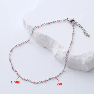 Detail of bohemian silver chain anklet with 1.5mm and 2mm pink enamel beads
