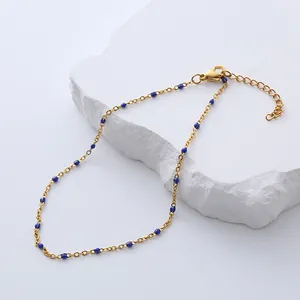 Gold stainless steel bohemian bracelet with dark blue enamel beads and adjustable clasp
