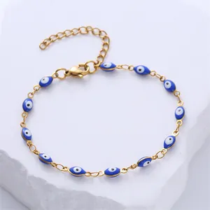 Gold plated stainless steel bracelet with blue enamel evil eye charms and adjustable chain