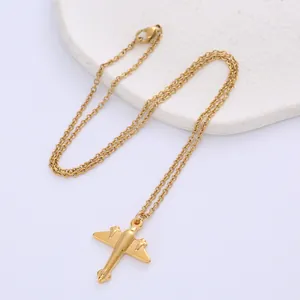 Detailed close-up of a gold vintage propeller airplane pendant with a polished finish