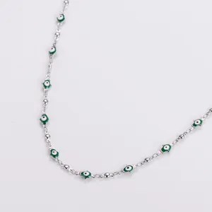 Silver stainless steel Hamsa hand necklace with green enamel evil eye charms for women