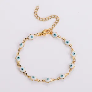 Golden chain bracelet featuring colorful evil eye palm charms and lobster clasp