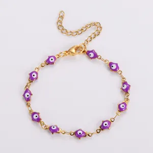 Gold Hamsa Hand bracelet with purple enamel charms and evil eye details for protection