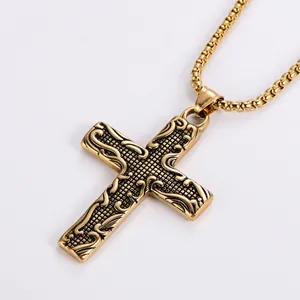 Collier avec pendentif croix en acier titane doré vintage aux gravures ornementales