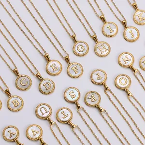 18k gold plated necklace featuring alphabet charms and white shell circular pendants